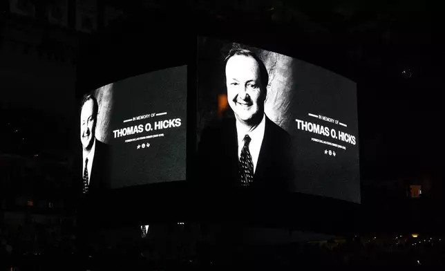 A scoreboard graphic is shown recognizing former Dallas Stars owner Tom Hicks prior to an NHL game against the Pittsburgh Penguins Sunday, Dec. 7, 2025, in Dallas. (AP Photo/Sam Hodde)