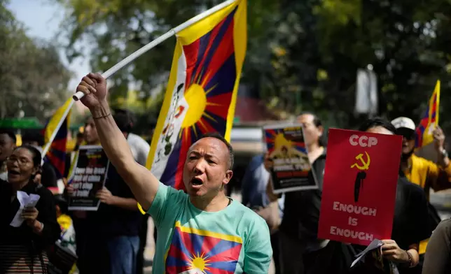 Sonam Tashi takes part in a demonstration to commemorate the anniversary of the 1959 uprising in Tibet against the Chinese rule, in New Delhi, India, March 10, 2025. (AP Photo/Manish Swarup)