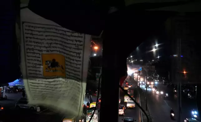 Tibetan prayers hang from a footbridge at Majanu ka Tila, an exile Tibetan settlement, in New Delhi, India, March 5, 2025. (AP Photo/Manish Swarup)