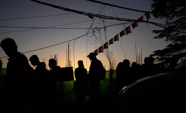 Tibetan flags hang above a street to commemorate the anniversary of the 1959 uprising in Tibet against the Chinese rule, in Mcleodganj near Dharamshala, India, March 6, 2025. (AP Photo/Manish Swarup)