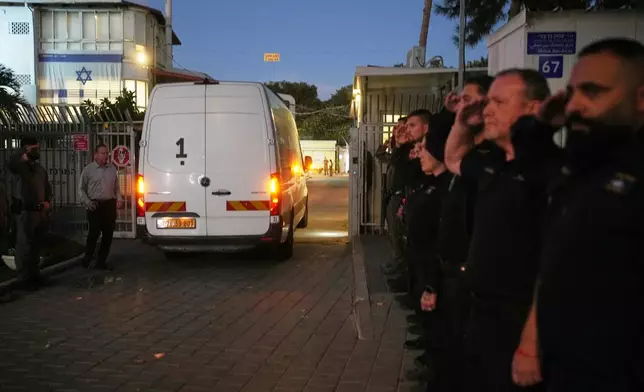 A vehicle carrying the remains of a person whom Hamas claims is a deceased hostage, transferred earlier today by Gaza militants to Israeli authorities, arrives at the Abu Kabir Forensic Institute in Tel Aviv, Israel, Tuesday, Dec. 2, 2025. (AP Photo/Ohad Zwigenberg)