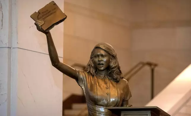 A statue of Virginia civil rights activist Barbara Rose Johns, whose statue will replace one of Robert E. Lee as one of Virginia's two statues on display at the Capitol, is unveiled Tuesday, Dec. 16, 2025, in Washington. (AP Photo/Mark Schiefelbein)