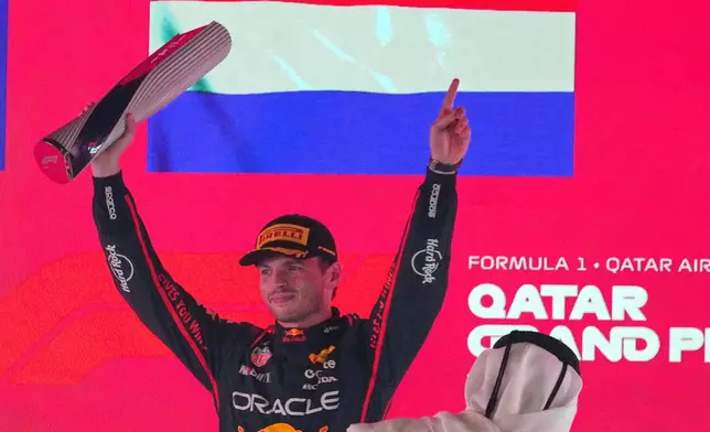 Red Bull driver Max Verstappen of the Netherlands celebrates after winning the Qatar Formula One Grand Prix, in Lusail, Qatar, Sunday, Nov. 30, 2025.(AP Photo/Altaf Qadri)