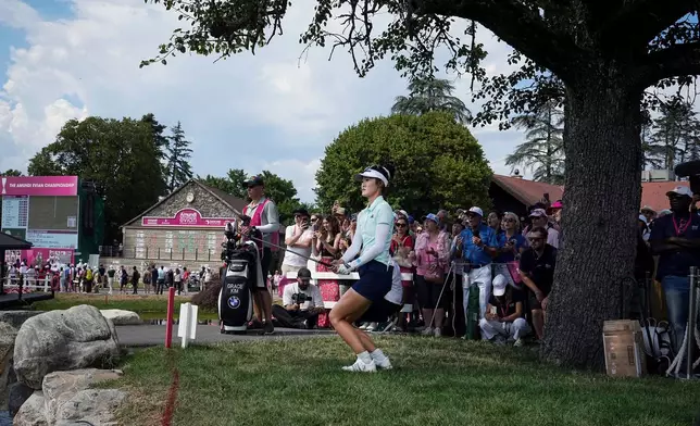 FILE - Grace Kim, of Australia, plays on the 18th hole on her way to win the Evian Championship women's golf tournament, in Evian, eastern France, Sunday, July 13, 2025. (AP Photo/Laurent Cipriani, file)
