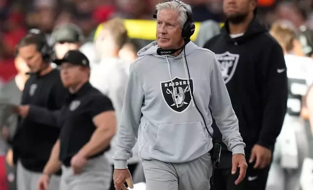 Las Vegas Raiders head coach Pete Carroll walks on the sideline during the first half of an NFL football game against the Houston Texans, Sunday, Dec. 21, 2025, in Houston. (AP Photo/Eric Christian Smith)
