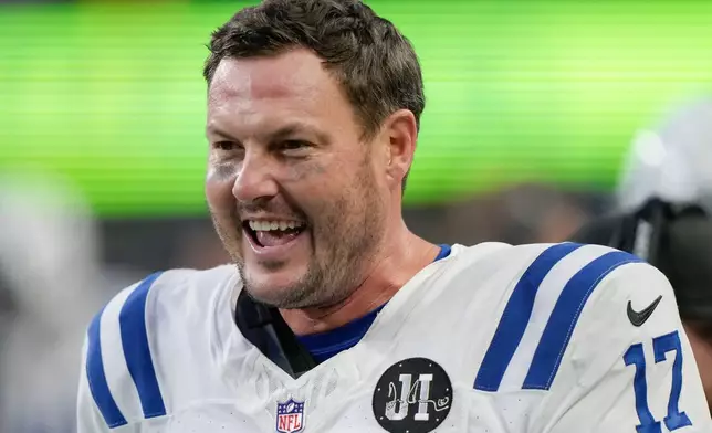 Indianapolis Colts quarterback Philip Rivers reacts during the second half of an NFL football game against the Seattle Seahawks, Sunday, Dec. 14, 2025, in Seattle. (AP Photo/Stephen Brashear)