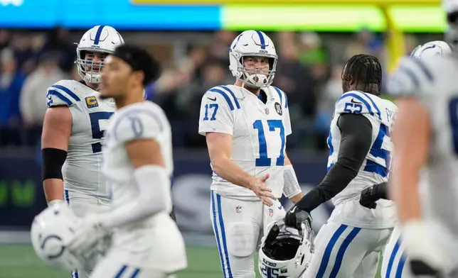 Indianapolis Colts quarterback Philip Rivers (17) walks off the field after throwing an interception in the second half of an NFL football game against the Seattle Seahawks, Sunday, Dec. 14, 2025, in Seattle. (AP Photo/Stephen Brashear)