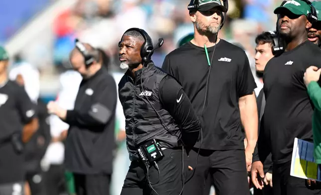 New York Jets head coach Aaron Glenn looks on during the first half against the Jacksonville Jaguars in an NFL football game, Sunday, Dec. 14, 2025, in Jacksonville, Fla. (AP Photo/Phelan M. Ebenhack)