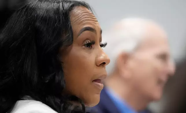 Fulton County District Attorney Fani Willis is seen at the Georgia State Capitol during questioning from a Georgia State Senate panel about her prosecution of President Donald Trump on Wednesday, Dec. 17, 2025, in Atlanta. (AP Photo/Brynn Anderson)