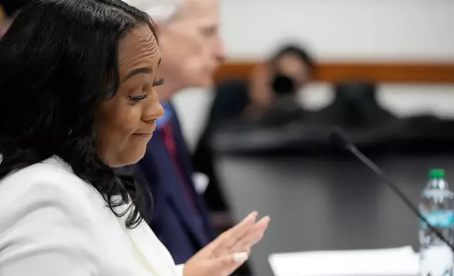 Fulton County District Attorney Fani Willis is seen at the Georgia State Capitol during questioning from a Georgia State Senate panel about her prosecution of President Donald Trump on Wednesday, Dec. 17, 2025, in Atlanta. (AP Photo/Brynn Anderson)