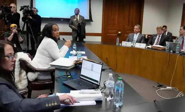 Fulton County District Attorney Fani Willis is seen at the Georgia State Capitol during questioning from a Georgia State Senate panel about her prosecution of President Donald Trump on Wednesday, Dec. 17, 2025, in Atlanta. (AP Photo/Brynn Anderson)