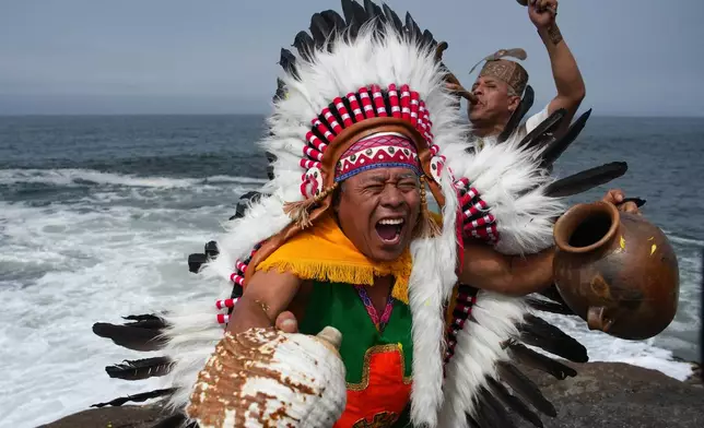 Shamans perform an annual ritual to predict political and social issues for the new year in Lima, Peru, Monday, Dec. 29, 2025. (AP Photo/Guadalupe Pardo)