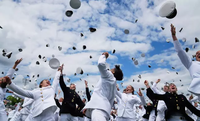 Graduates of the U.S. Naval Academy toss their caps during the academy's graduation and commissioning ceremony, at the U.S. Naval Academy in Annapolis, Md., May 23, 2025. (AP Photo/Stephanie Scarbrough, File)