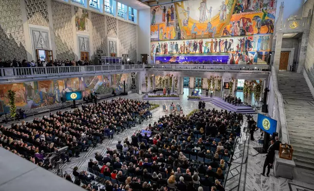The daughter of the Nobel Peace Prize laureate, Ana Corina Sosa, accepts the award on behalf of her mother, Venezuelan opposition leader Maria Corina Machado, during the Nobel Peace Prize ceremony at Oslo City Hall, Norway, Wednesday Dec. 10, 2025. (Stian Lysberg Solum/NTB Scanpix via AP)