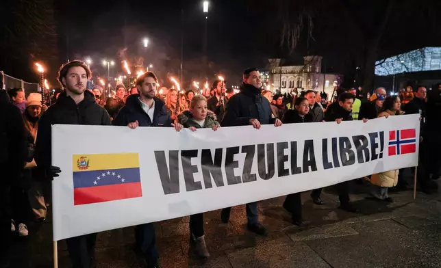 People attend a rally by the Norwegian Venezuelan Justice Alliance in honor of Nobel Peace Prize laureate Maria Corina Machado in Oslo, Wednesday, Dec. 10, 2025. (Amanda Pedersen Giske/NTB Scanpix via AP)