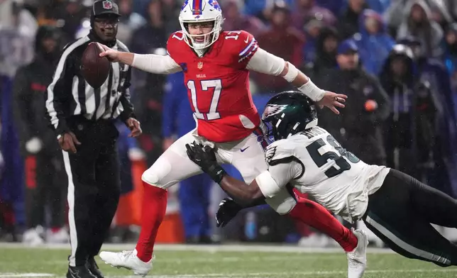 Buffalo Bills' Josh Allen (17) is sacked by Philadelphia Eagles' Jalyx Hunt (58) during the second half of an NFL football game, Sunday, Dec. 28, 2025, in Buffalo, N.Y. (AP Photo/Gene J. Puskar)