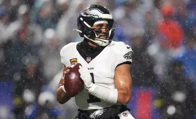 Philadelphia Eagles' Jalen Hurts passes during the second half of an NFL football game against the Buffalo Bills, Sunday, Dec. 28, 2025, in Buffalo, N.Y. (AP Photo/Gene J. Puskar)