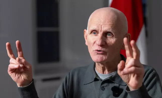 Nobel Peace Prize laureate Ales Bialiatski, one of the Belarusian prisoners released on Saturday, gestures during an interview with the Associated Press in Vilnius, Lithuania, on Sunday, Dec. 14, 2025. (AP Photo/Mindaugas Kulbis)
