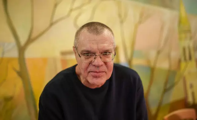 Viktar Babaryka, key Belorussian opposition figure looks on during a joint press conference with Uladzimir Labkovich, human rights activist, Maria Kolesnikova, key Belorussian opposition figure and Alyaksandr Feduta, Belarusian politician after being released from detention in Belarus, in Chernihiv, Ukraine, Sunday, Dec. 14, 2025. (AP Photo/Evgeniy Maloletka)