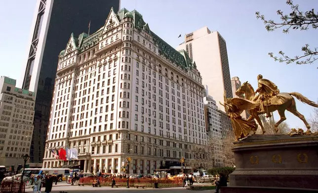 FILE - Pedestrians walk in front of the Plaza Hotel in New York, April 11, 1995. (AP Photo/Marty Lederhandler, File)
