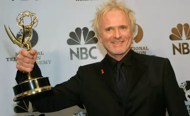 FILE - Anthony Geary holds up his Emmy as poses for photographers after winning "Outstanding Lead Actor In A Drama Series" at the 31st Annual Daytime Emmy Awards in New York, May 21, 2004.(AP Photo/ Tina Fineberg, File)