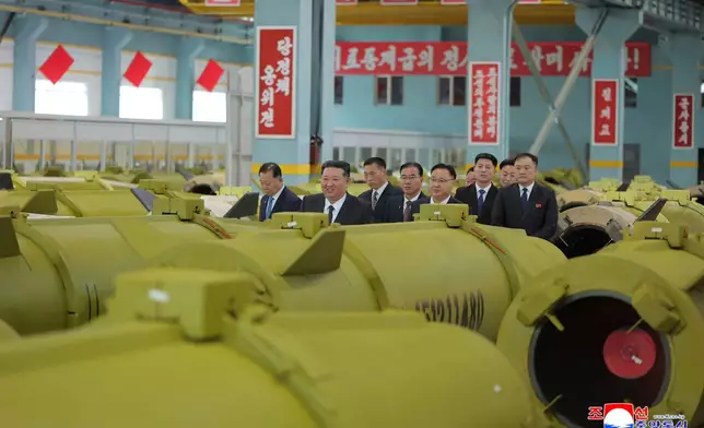 In this undated photo provided Friday, Dec. 26, 2025, by the North Korean government, its leader Kim Jong Un inspects missile and shell production at a factory in an undisclosed location, North Korea. Independent journalists were not given access to cover the event depicted in this image distributed by the North Korean government. The content of this image is as provided and cannot be independently verified. Korean language watermark on image as provided by source reads: "KCNA" which is the abbreviation for Korean Central News Agency. (Korean Central News Agency/Korea News Service via AP)
