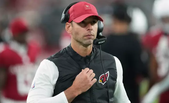 Arizona Cardinals head coach Jonathan Gannon walks on the sideline during the first half of an NFL football game against the Jacksonville Jaguars Sunday, Nov. 23, 2025, in Glendale, Ariz. (AP Photo/Ross D. Franklin)