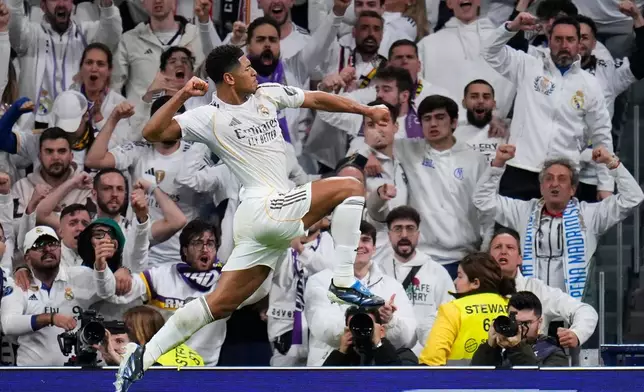 Real Madrid's Jude Bellingham celebrates after scoring the opening goal during the Spanish La Liga soccer match between Real Madrid and Sevilla in Madrid, Spain, Saturday, Dec. 20, 2025. (AP Photo/Manu Fernandez)