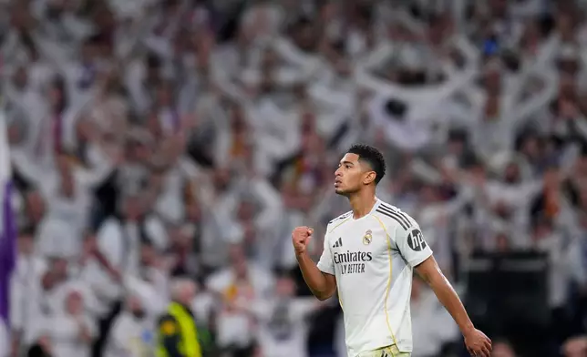 Real Madrid's Jude Bellingham, celebrates after scoring the opening goal during the Spanish La Liga soccer match between Real Madrid and Sevilla in Madrid, Spain, Saturday, Dec. 20, 2025. (AP Photo/Manu Fernandez)