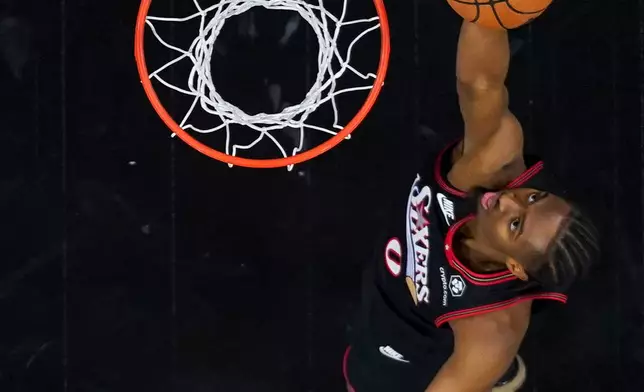 Philadelphia 76ers' Tyrese Maxey goes up for a shot during the first half of an NBA basketball game against the Dallas Mavericks, Saturday, Dec. 20, 2025, in Philadelphia. (AP Photo/Chris Szagola)
