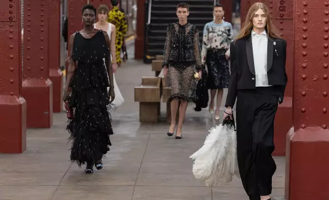 Models walk the runway during the CHANEL 2025/26 Métiers d'art fashion show at Bowery subway station on Tuesday, Dec. 2, 2025, in New York. (Photo by CJ Rivera/Invision/AP)