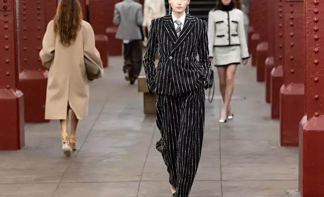 Models walk the runway during the CHANEL 2025/26 Métiers d'art fashion show at Bowery subway station on Tuesday, Dec. 2, 2025, in New York. (Photo by CJ Rivera/Invision/AP)