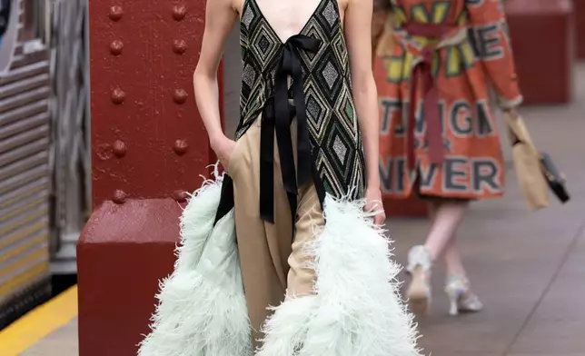 A model walks the runway during the CHANEL 2025/26 Métiers d'art fashion show at Bowery subway station, Tuesday, Dec. 2, 2025, in New York. (Photo by CJ Rivera/Invision/AP)