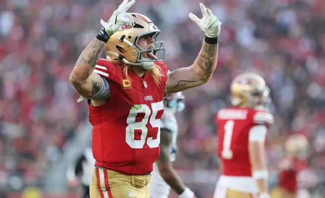San Francisco 49ers tight end George Kittle (85) celebrates a first down during the second half of an NFL football game against the Tennessee Titans, Sunday, Dec. 14, 2025, in Santa Clara, Calif. (AP Photo/Jed Jacobsohn)