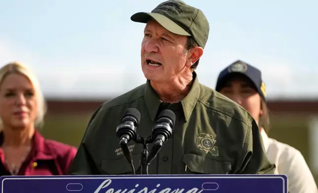FILE - Louisiana Gov. Jeff Landry speaks to reporters at the Louisiana State Penitentiary in Angola, La., Sept. 3, 2025. (AP Photo/Gerald Herbert, File)