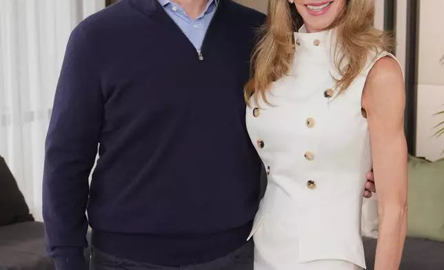 Michael and Susan Dell, pose for photographs Nov. 26, 2025, in New York. (AP Photo/Frank Franklin II)