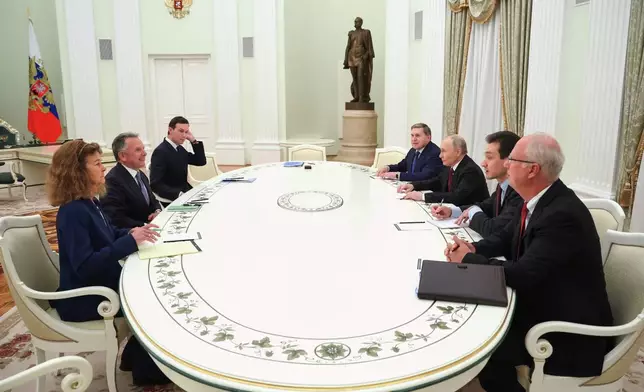 Russian President Vladimir Putin, third right, Russian Presidential foreign policy adviser Yuri Ushakov, fourth right, and Russian Direct Investment Fund CEO Special Presidential Representative for Investment and Economic Cooperation with Foreign Countries Kirill Dmitriev, right, attend talks with U.S. special envoy Steve Witkoff, second left, and Jared Kushner, U.S. President Donald Trump's son-in-law, third, at the Senate Palace of the Kremlin in Moscow, Russia, Tuesday, Dec. 2, 2025. (Alexander Kazakov, Sputnik, Kremlin Pool Photo via AP)