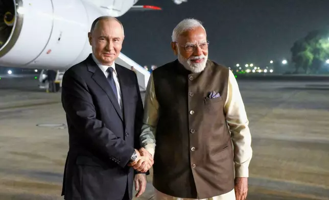 Russian President Vladimir Putin, left, and Indian Prime Minister Narendra Modi pose for a photo at the Palam Air Base in New Delhi, India, on Thursday, Dec. 4, 2025. (Grigory Sysoyev, Sputnik, Kremlin Pool Photo via AP)