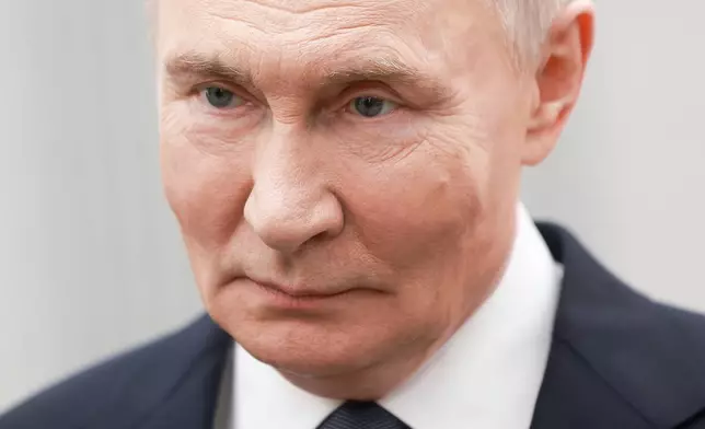 Russian President Vladimir Putin attends an international forum of civil participation "We Are Together" in Moscow, Russia, Wednesday, Dec. 3, 2025. (Alexander Shcherbak, Sputnik, Kremlin Pool Photo via AP)