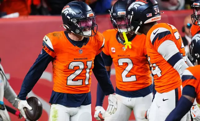 Denver Broncos' Riley Moss celebrates an interception during the second half of an NFL football game against the Green Bay Packers Sunday, Dec. 14, 2025, in Denver. (AP Photo/Jack Dempsey)
