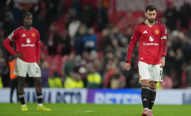 Manchester United's Bruno Fernandes walks off the pitch after a Premier League soccer match between Manchester United and Bournemouth in Manchester, England, Monday, Dec. 15, 2025. (AP Photo/Jon Super)