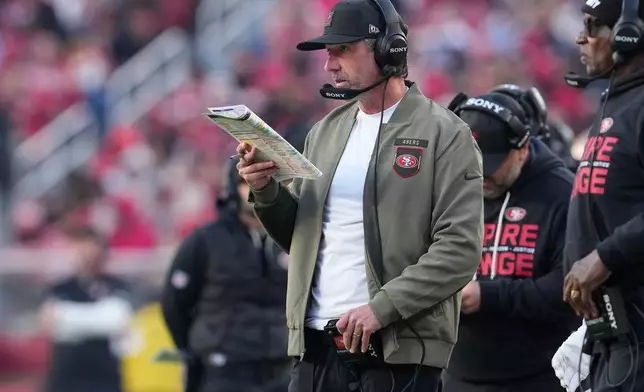 San Francisco 49ers head coach Kyle Shanahan looks onto the field during the second half of an NFL football game against the Tennessee Titans, Sunday, Dec. 14, 2025, in Santa Clara, Calif. (AP Photo/Godofredo A. Vásquez)