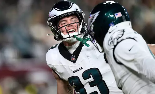 Philadelphia Eagles cornerback Cooper Dejean (33) celebrates after an interception against the Washington Commanders during the second half of an NFL football game, Saturday, Dec. 20, 2025, in Landover, Md. (AP Photo/Nick Wass)