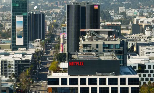 A Netflix sign is displayed atop a building in Los Angeles, Thursday, Dec. 18, 2025. (AP Photo/Jae C. Hong)