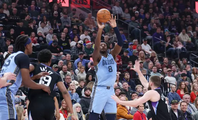 Memphis Grizzlies forward Jaren Jackson Jr. (8) goes for a shot against the Utah Jazz during the first half of an NBA basketball game, Tuesday, Dec. 23, 2025, in Salt Lake City. (AP Photo/Rob Gray)