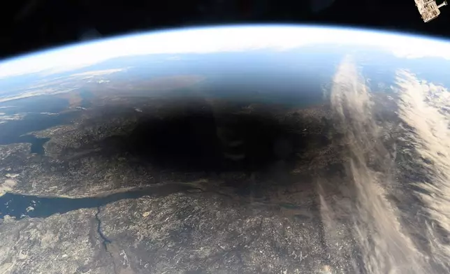 CORRECTS MONTH FILE - This photo provided by NASA shows the Moon's shadow covering portions of Canada and the U.S. during a total solar eclipse as seen from the International Space Station, on Monday, April 8, 2024. (NASA via AP, File)