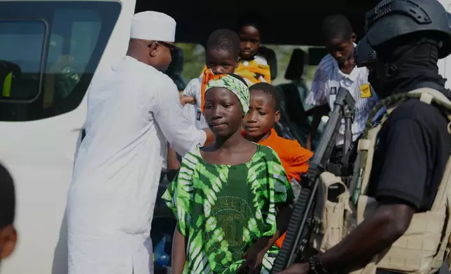 Freed students from St. Mary's Catholic School in the Papiri community arrive at the government house, in Minna, Nigeria, Monday, Dec. 22, 2025. (AP Photo/Sunday Alamba)