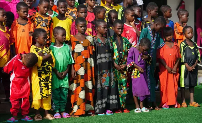 Freed students of St. Mary's Catholic School in the Papiri community pose for photographs upon their arrival at the government house, in Minna, Nigeria, Monday, Dec. 22, 2025. (AP Photo/Sunday Alamba)