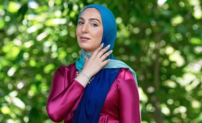 FILE - Yasmin Elhady, a matchmaker featured on the series, "Muslim Matchmaker," on Hulu, poses in Falls Church, Va, on Aug. 12, 2025. (AP Photo/Mariam Zuhaib, File)