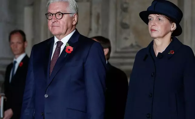 FILE - German President Frank-Walter Steinmeier, front left, and his wife, Elke Budenbender, right, leave Westminster Abbey in London, England, Nov. 11, 2018. (AP Photo/Alastair Grant, File)